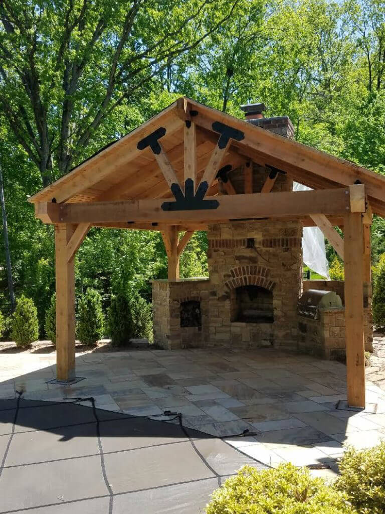 A Backyard Pavilion With A Fireplace Serves As A Multi Purpose Outdoor Living Space Ozco Building Products